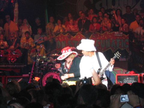 1989 Ford Bronco - A band performs live on stage at an event, with a banner visible in the background.