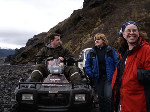 1996 Ford Bronco - Three people stand near an ATV and a white SUV in a rocky, mountainous landscape.