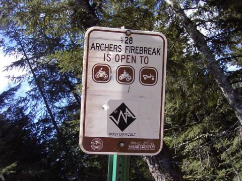 1980 Ford Bronco - Sign shows icons for allowed vehicles on the Archers Firebreak trail.