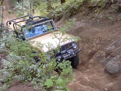 1980 Ford Bronco - Ford Bronco tackling a challenging off-road course.