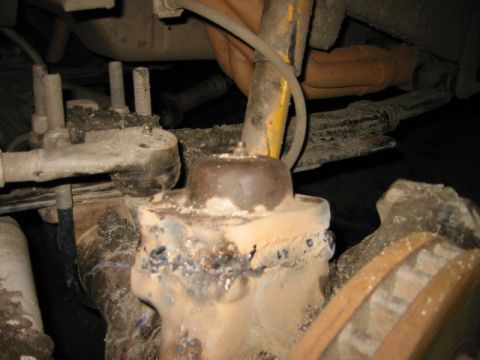 1985 Ford Bronco - friend's 1 ton chevy broke the upper Kin pin cap. sheared the bolts right off so i welded it back on :)