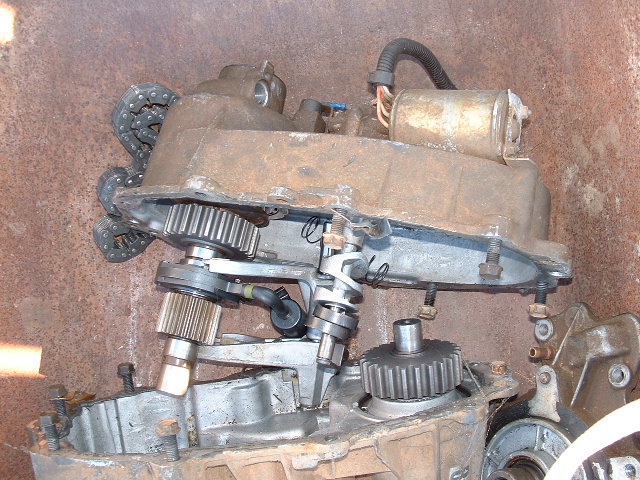Rusty transfer case with exposed gears and a chain drive mechanism