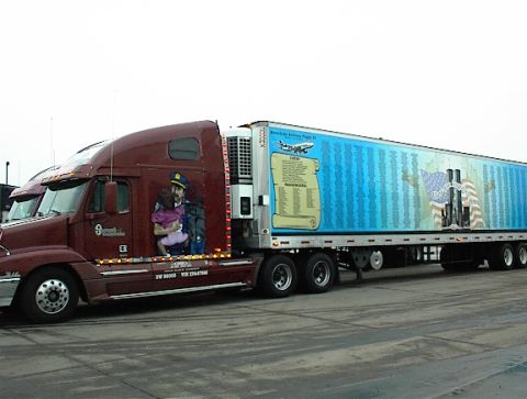 1997 Ford Expedition - Semi-truck with a 9/11 memorial mural on its trailer and a depiction of a first responder on the cab.