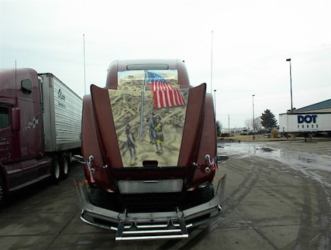 1997 Ford Expedition - A semi-truck hood features a patriotic mural depicting firefighters and the American flag.