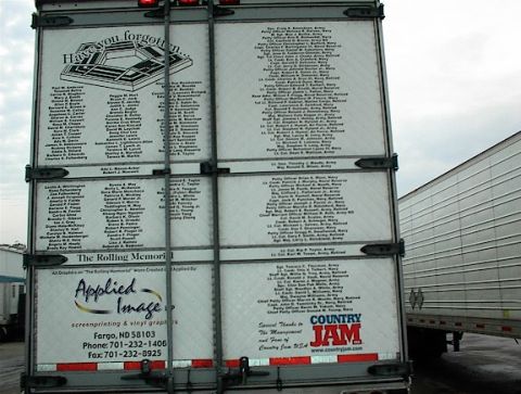 1997 Ford Expedition - Trailer displays names of individuals and logos, with another trailer parked nearby.
