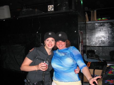 1989 Ford Bronco - Two women pose for a photo in what appears to be a dimly lit indoor venue.