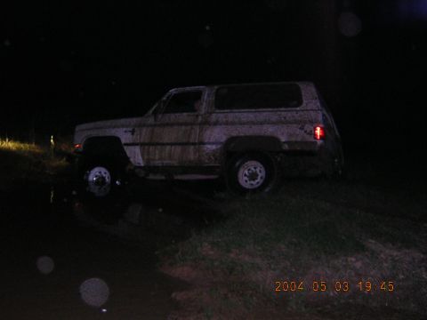 1984 Chevrolet Blazer - This 1984 Chevrolet Blazer appears to be stuck in the mud, captured in a nighttime photo.