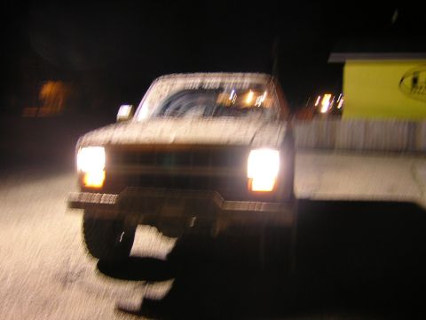 1984 Chevrolet Blazer - The front of a 1984 Chevrolet Blazer is visible at night, with headlights illuminated.