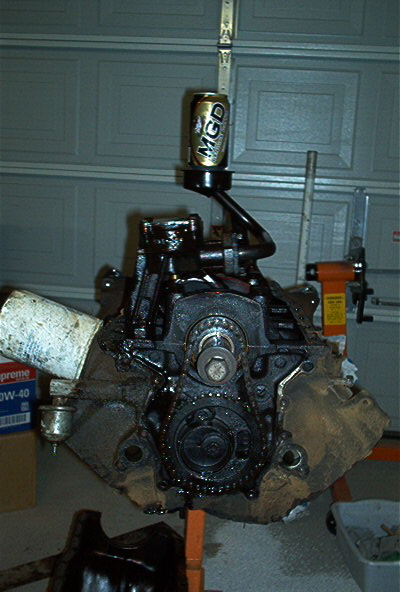 1986 Ford Bronco - I lifted the oil pan and low and behold the old goat was holding back on me! Drinkin' on the job. Bad motor! Bad!