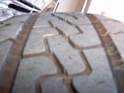 1979 Ford Bronco - Close-up view of a tire's tread pattern, with a watermark at the bottom right.