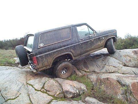 1981 Ford Bronco - This Ford Bronco is navigating a rocky obstacle course, showing its off-road capabilities.