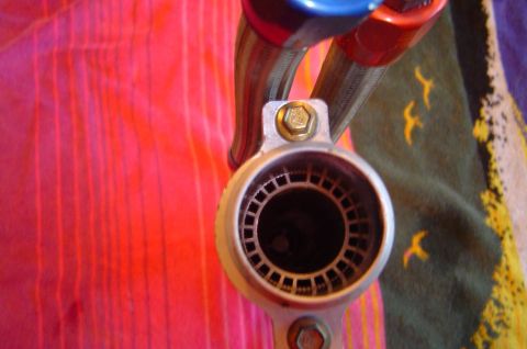 1993 Ford Bronco - Close-up view of an exhaust pipe fitting, showing the internal grate detail.
