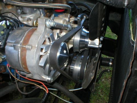 1978 Ford Bronco - Engine bay detail showing the alternator, belt, and pulley system.