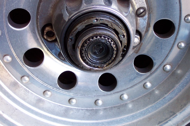 Close-up of a front wheel hub with locking hub removed, exposing the splined spindle