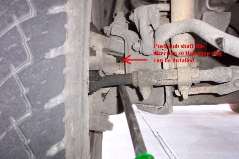1992 Ford Bronco - Push the stub shaft outwards so that you can install the snapring on the end of the shaft