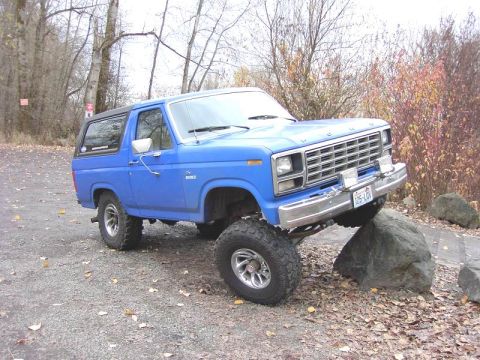 1980 Ford Bronco - 1980 Ford Bronco navigating an obstacle course with large rocks.