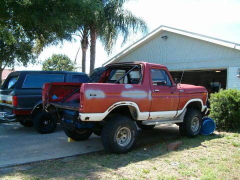 1979 Ford Bronco - This 1979 Ford Bronco is undergoing some work, with primer visible on the body panels and a roll cage installed.