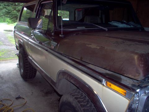 1979 Ford Bronco - This 1979 Ford Bronco is shown in a two-tone brown and tan paint scheme from a 3/4 front perspective.