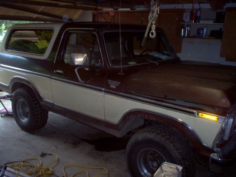 1979 Ford Bronco - This 1979 Ford Bronco is parked inside a garage with some tools and equipment around it.