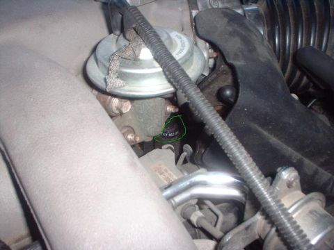 1996 Ford Taurus - A close-up view of an engine component, with the identifier EV-152 clearly visible.