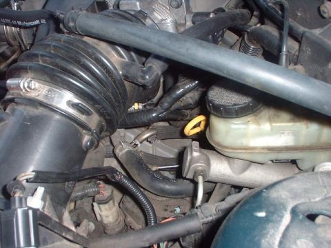 1996 Ford Taurus - Close-up view of an engine bay, showing components like the air intake and brake fluid reservoir.