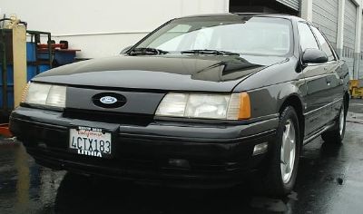 1998 Ford Taurus - Front view of a black sedan, likely a 1992 model, with a California license plate.