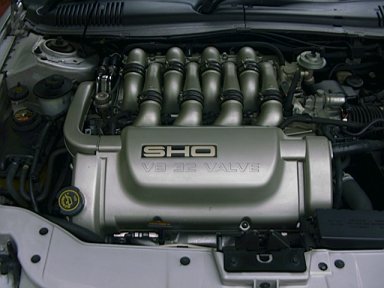 1998 Ford Taurus - Close-up of a Ford SHO V8 32 Valve engine, the SuperMotors logo at the bottom.