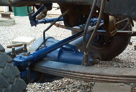 1986 Ford Bronco - Underside view of vehicle steering and suspension parts, likely during a repair or upgrade.