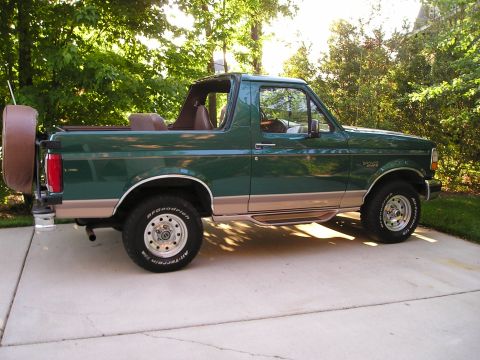 1996 Ford Bronco - This 1996 Ford Bronco is seen from the side, its iconic body style and a spare tire on the back.