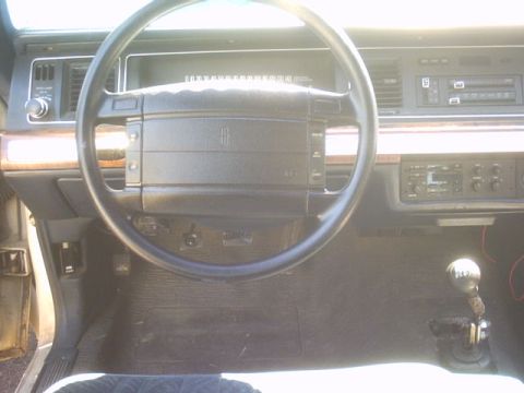 1991 Ford Crown Victoria - Interior view of a 1991 Ford Crown Victoria, highlighting the dashboard and steering wheel.