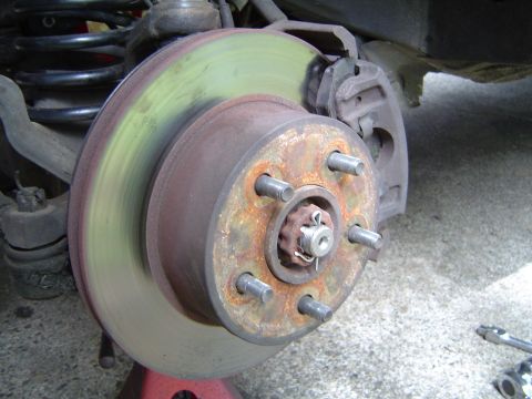 1993 Jeep Grand Cherokee - Then the rotor, caliper, and the big nut which you torque to 175