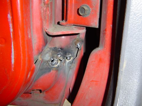 1993 Jeep Grand Cherokee - The drivers door is torn under the hinge