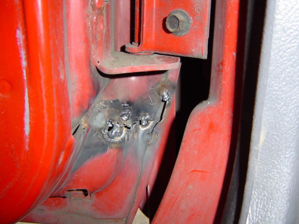 The drivers door is torn under the hinge