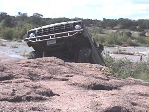 1978 Ford Bronco - This 1978 Ford Bronco is navigating challenging off-road conditions by a river.