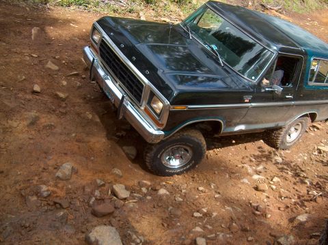 1978 Ford Bronco - A black 1978 Ford Bronco navigates a rocky, dirt path.