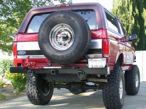 1996 Ford Bronco - Rear view of a 1996 Ford Bronco, showing the spare tire and custom bumper.