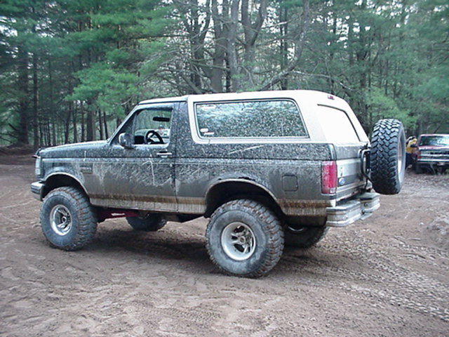 1993 Ford Bronco, rear quarter view, dirty, with spare tire
