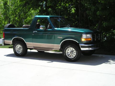 1996 Ford Bronco - This 1996 Ford Bronco SUV is shown from a three-quarter front angle, its green exterior and tan lower body trim.