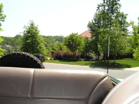 1996 Ford Bronco - View from inside a 1996 Ford Bronco, looking out at a suburban neighborhood street.
