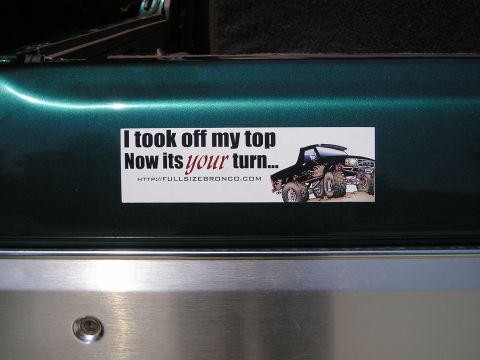 1996 Ford Bronco - A bumper sticker displays a lifted truck and a message about removing the vehicle's top.