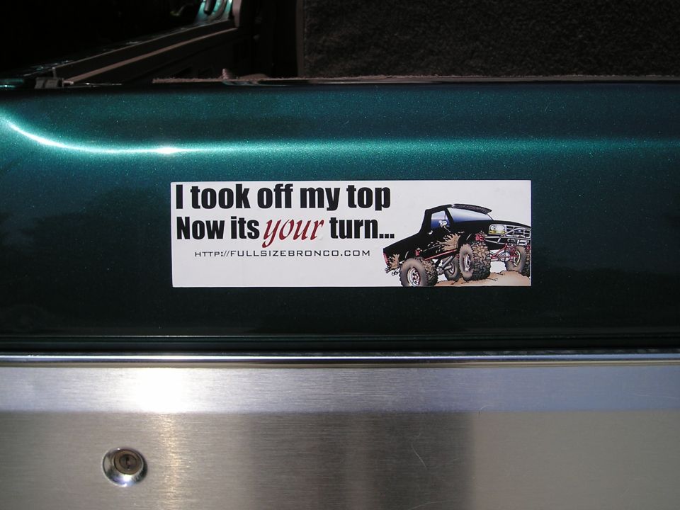 Fullsizebronco.com bumper sticker on teal metallic body panel above aluminum trim