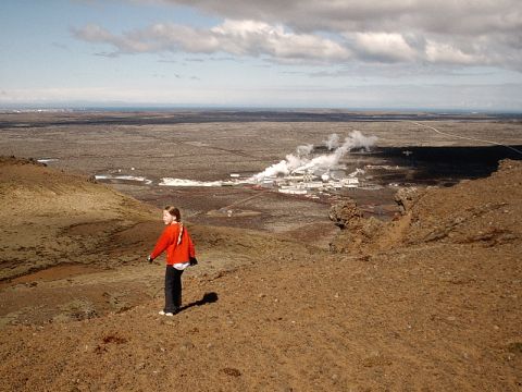 1996 Ford Bronco - A young girl surveys a geothermal power plant from a hillside in a desolate, rocky terrain.