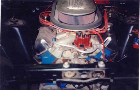 1967 Ford Fairlane - Close-up view of a car's V8 engine compartment, showing the air filter and distributor.