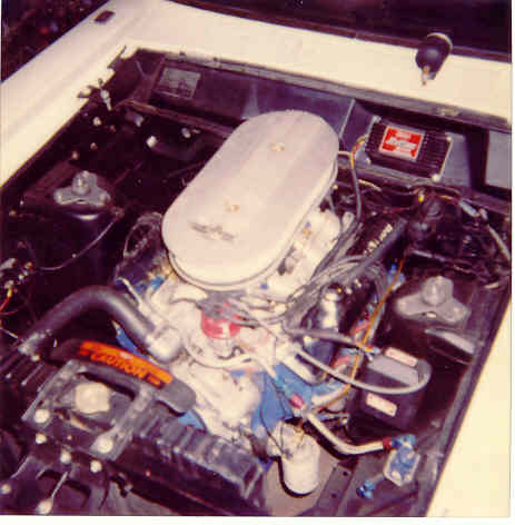 1967 Ford Fairlane - Engine bay of a 1967 Ford Fairlane, an oval air cleaner and a red ignition box. The registry label may be incorrect.