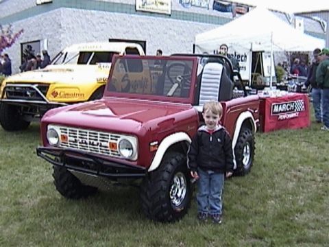 1995 Ford Bronco - My son Hunter in front of a golf-cart Early Bronco