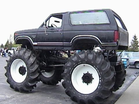 1995 Ford Bronco - This modified truck features oversized tires and a significantly raised suspension system.