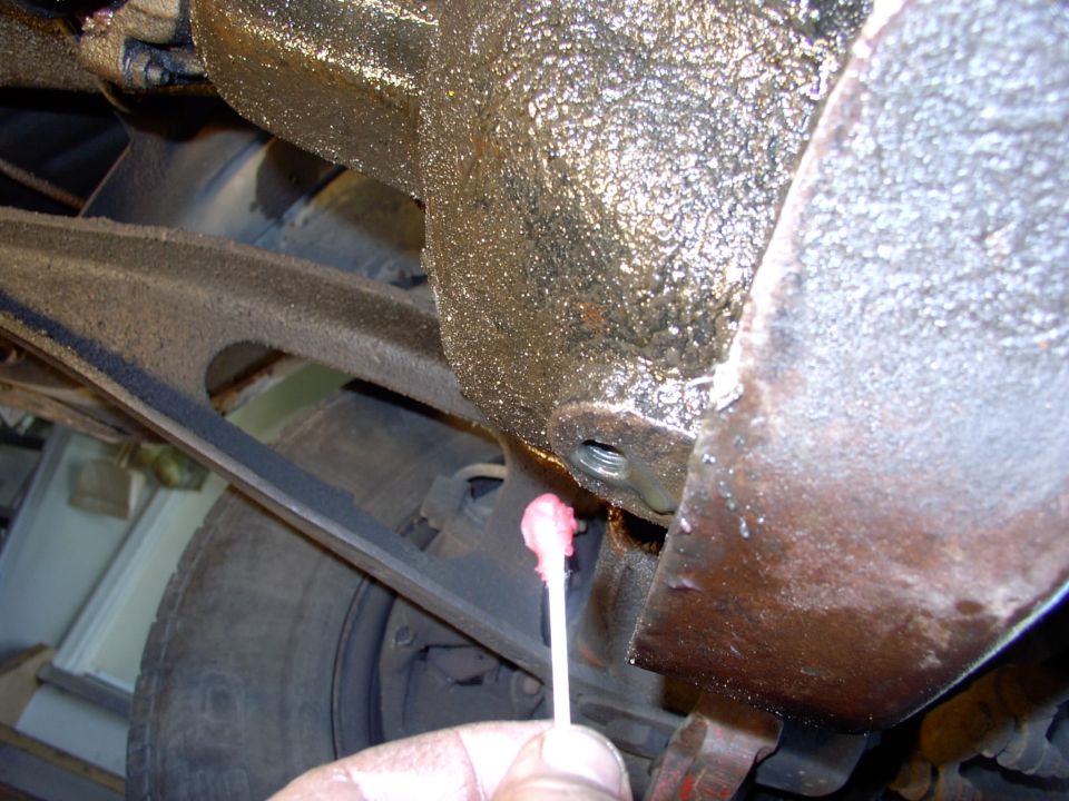 A Q-tip with grease helps grab any of the filings your drill bit (with grease in it's flutes) missed.