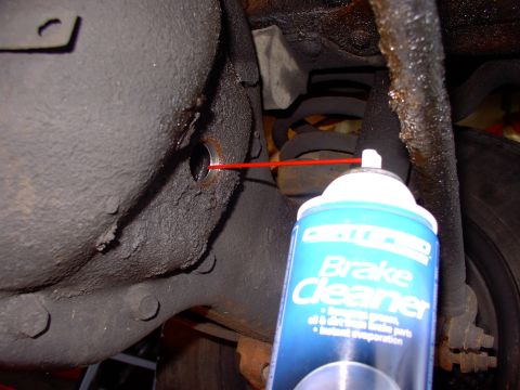 1986 Ford Bronco - Hose the whole thing out with some brake cleaner. I even put the new plug in and soaked it for a while before draining one last time.