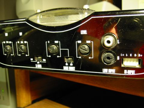 1985 Ford Bronco - Close-up of car amplifier controls, showing various adjustment knobs and input/output jacks.