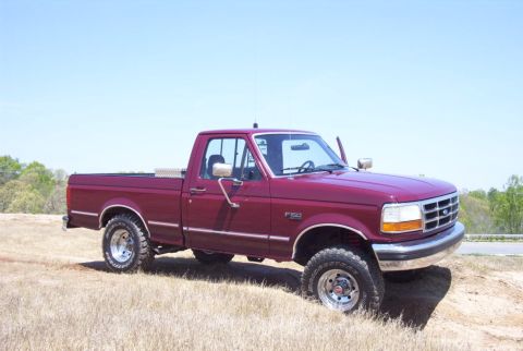 1992 Ford F-150 - This 1992 Ford F-150 pickup truck is shown from a 3/4 front angle on a sunny day.